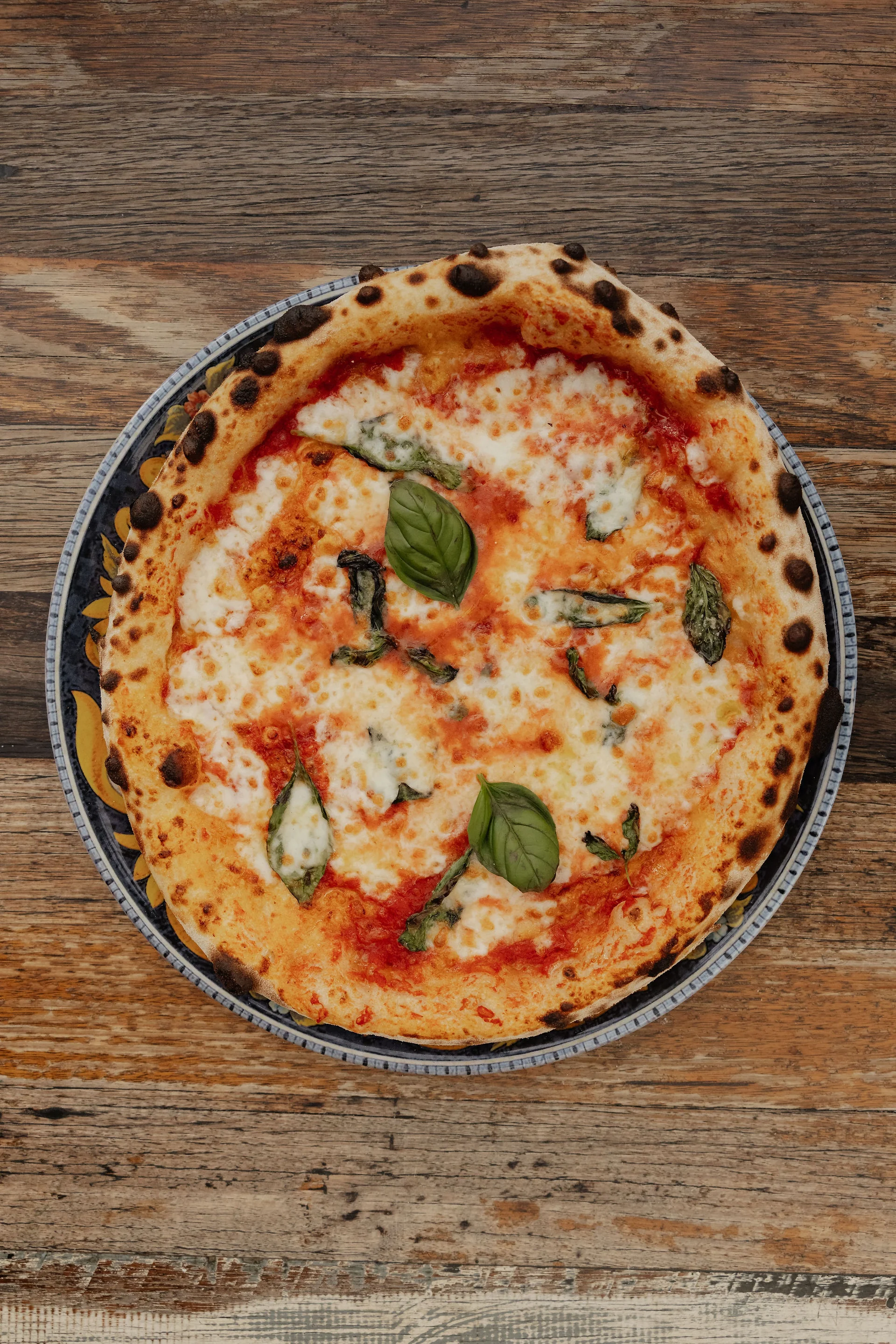 Wood-fired Margherita pizza with fresh basil